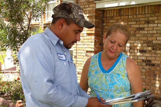 Cytech showing a woman an estimate